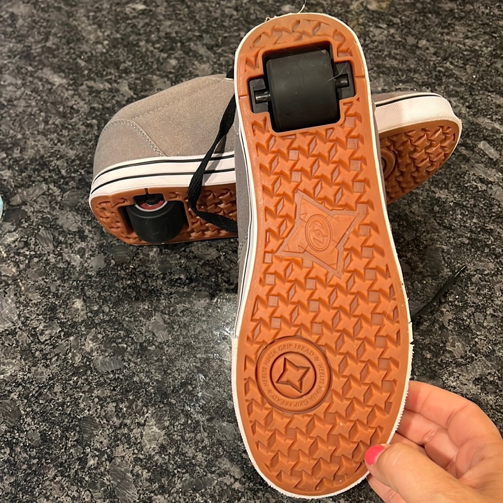 Heelys brand sneakers with removable wheels in the heals